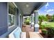 Comfortable front porch featuring seating with columns and views of the outdoors at 17378 Cruiser Bnd, Land O Lakes, FL 34638