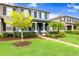 Well-maintained front yard and vibrant landscaping complements the townhome's facade at 17378 Cruiser Bnd, Land O Lakes, FL 34638