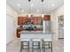 Modern kitchen with granite countertops, stainless steel appliances, and an island with seating at 17378 Cruiser Bnd, Land O Lakes, FL 34638