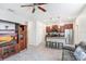 Open-concept living space featuring a modern kitchen, cozy seating, and lots of natural light at 17378 Cruiser Bnd, Land O Lakes, FL 34638