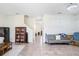A clean and neutral living room with tile flooring, open space, and lots of natural light at 17378 Cruiser Bnd, Land O Lakes, FL 34638