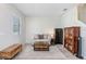 Cozy living room with an area rug, a bookshelf, and ample natural light, perfect for relaxing at 17378 Cruiser Bnd, Land O Lakes, FL 34638