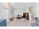 Inviting living room with tile flooring and staircase, offering ample space and natural light at 17378 Cruiser Bnd, Land O Lakes, FL 34638
