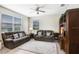 Inviting living room featuring neutral decor, plush sofas, and a large entertainment center at 17378 Cruiser Bnd, Land O Lakes, FL 34638