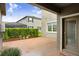 Paved patio area surrounded by lush landscaping, offering a private outdoor space at 17378 Cruiser Bnd, Land O Lakes, FL 34638