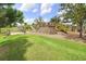 Community playground with climbing walls, slides, wooden bridges, and mulched play areas in a green space at 17378 Cruiser Bnd, Land O Lakes, FL 34638