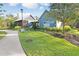 Exterior view of a swim club and game room surrounded by green landscaping at 17378 Cruiser Bnd, Land O Lakes, FL 34638