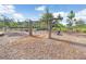 A wooden swing set is situated in a community park setting at 17378 Cruiser Bnd, Land O Lakes, FL 34638