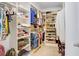 Spacious walk-in closet with custom shelving, ample storage, and organized layout at 17378 Cruiser Bnd, Land O Lakes, FL 34638