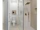 Modern bathroom with a glass-enclosed shower, and contemporary fixtures at 1800 Loch Haven Ct, Trinity, FL 34655