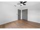 Bedroom featuring a ceiling fan and spacious closet at 1800 Loch Haven Ct, Trinity, FL 34655