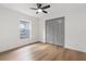 Cozy bedroom featuring a closet and natural light at 1800 Loch Haven Ct, Trinity, FL 34655