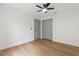 Bright bedroom with light-colored wood floor and ceiling fan at 1800 Loch Haven Ct, Trinity, FL 34655