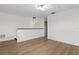 Bonus room with hardwood floors and modern light fixture at 1800 Loch Haven Ct, Trinity, FL 34655