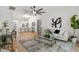 Bright living room showcasing an open floor plan and modern decor with access to the kitchen at 1800 Loch Haven Ct, Trinity, FL 34655