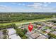 Aerial view of a residential neighborhood showcasing nearby green spaces and convenient highway access at 1800 Loch Haven Ct, Trinity, FL 34655