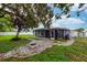 Picture of backyard with grass, patio, and grilling area at 1800 Pine St, Clearwater, FL 33764