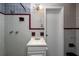 Retro bathroom featuring tile walls, and vanity with a sink at 1800 Pine St, Clearwater, FL 33764