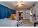 Bedroom featuring wood-look tile flooring, a rocking chair, and closet at 1800 Pine St, Clearwater, FL 33764