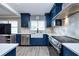 Beautiful eat-in kitchen featuring modern appliances and quartz countertops at 1800 Pine St, Clearwater, FL 33764