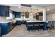 Modern kitchen featuring an island with seating, stainless steel appliances, and tile floors at 1800 Pine St, Clearwater, FL 33764