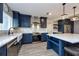 Updated kitchen with stainless steel appliances, bright countertops, and a breakfast bar at 1800 Pine St, Clearwater, FL 33764