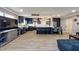 Living room with an open floor plan with kitchen, tile floors, and ample natural light at 1800 Pine St, Clearwater, FL 33764