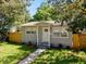 Lovely home with a cozy front porch and manicured landscaping enhancing its curb appeal at 1924 48Th S St, St Petersburg, FL 33711