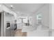 Modern kitchen featuring stainless steel appliances, bright white cabinets, and marble countertops at 1924 48Th S St, St Petersburg, FL 33711