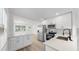 Modern kitchen featuring stainless steel appliances, sleek white cabinets, and marble countertops at 1924 48Th S St, St Petersburg, FL 33711