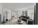 Inviting living room adjacent to the modern kitchen; a cozy and stylish space for relaxation at 1924 48Th S St, St Petersburg, FL 33711