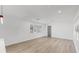 Bright living room with light wood floors and recessed lighting at 1924 48Th S St, St Petersburg, FL 33711