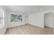 Bright living room with new flooring, large windows, and an inviting atmosphere at 1924 48Th S St, St Petersburg, FL 33711