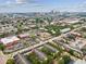 An aerial view of an apartment community with a view of the city skyline in the background at 2010 E Palm Ave # 14303, Tampa, FL 33605