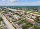 Aerial view of an apartment complex near a highway, with a view of the city skyline in the distance at 2010 E Palm Ave # 14303, Tampa, FL 33605