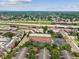 View of an apartment building near a highway, set within a community with trees at 2010 E Palm Ave # 14303, Tampa, FL 33605