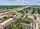 Aerial view of a residential community close to a highway and a building with brick exterior at 2010 E Palm Ave # 14303, Tampa, FL 33605