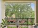Serene balcony with views of a lush, green landscape, perfect for quiet relaxation and enjoyment at 2010 E Palm Ave # 14303, Tampa, FL 33605