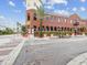 Attractive brick building with corner location, lush landscaping, and sidewalk access at 2010 E Palm Ave # 14303, Tampa, FL 33605