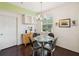 Dining area featuring a round glass table with seating for four and a modern chandelier at 2010 E Palm Ave # 14303, Tampa, FL 33605