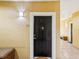 Inviting front door with stylish accents, leading to a well-maintained hallway in a secure building at 2010 E Palm Ave # 14303, Tampa, FL 33605