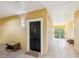 Exterior view of the unit's entry door with a welcoming atmosphere, set within a well-lit hallway at 2010 E Palm Ave # 14303, Tampa, FL 33605