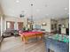 Fun game room with pool table, foosball, and stylish furnishings for entertainment and relaxation at 2010 E Palm Ave # 14303, Tampa, FL 33605