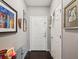 Entryway hallway featuring hardwood floors, neutral colored walls and contemporary artwork on the walls at 2010 E Palm Ave # 14303, Tampa, FL 33605