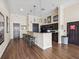 Community kitchen equipped with a bar, stools, and modern appliances for entertaining at 2010 E Palm Ave # 14303, Tampa, FL 33605