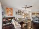 Cozy living room with hardwood floors, comfortable seating, contemporary artwork, and a ceiling fan at 2010 E Palm Ave # 14303, Tampa, FL 33605