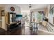 Cozy living room with a balcony, modern furniture, and hardwood flooring at 2010 E Palm Ave # 14303, Tampa, FL 33605