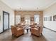A comfortable lounge area with armchairs, a coffee table, and a brick wall at 2010 E Palm Ave # 14303, Tampa, FL 33605