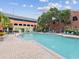 Gorgeous community pool with lounge chairs and umbrellas, perfect for relaxation and socializing at 2010 E Palm Ave # 14303, Tampa, FL 33605