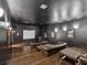 Home theater with a large projector screen, leather seating, and classic movie posters at 2010 E Palm Ave # 14303, Tampa, FL 33605